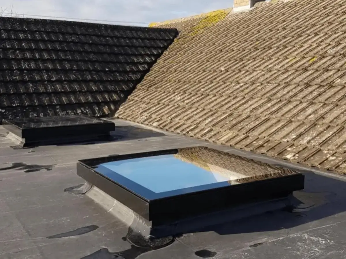 Contemporary flush-fitting square flat glass rooflight integrated into a high-spec, insulated warm flat roof system by Norfolk Exterior Solutions